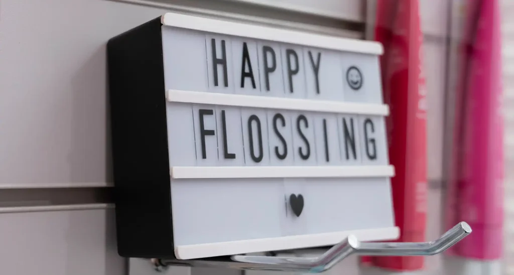'Happy Flossing' on light box signage
